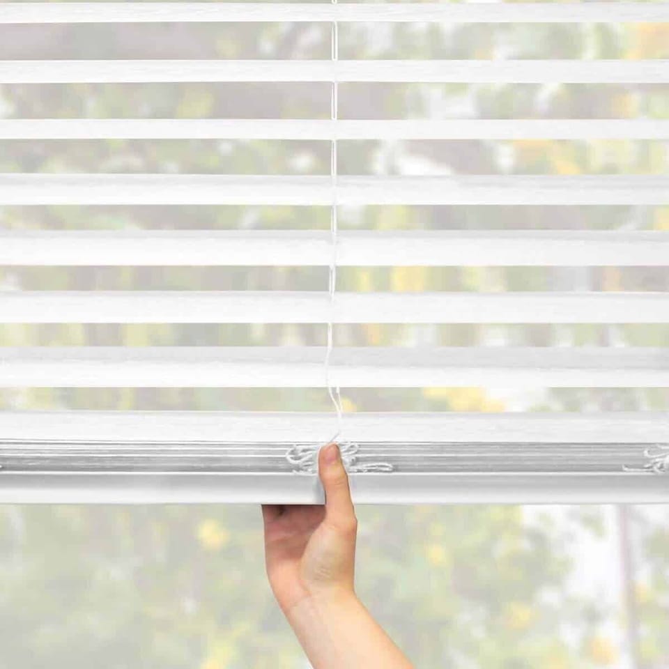 This home has cordless blinds. Just pull down or up!
