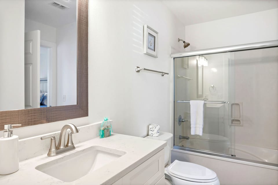 Downstairs bathroom attached to queen size bedroom.