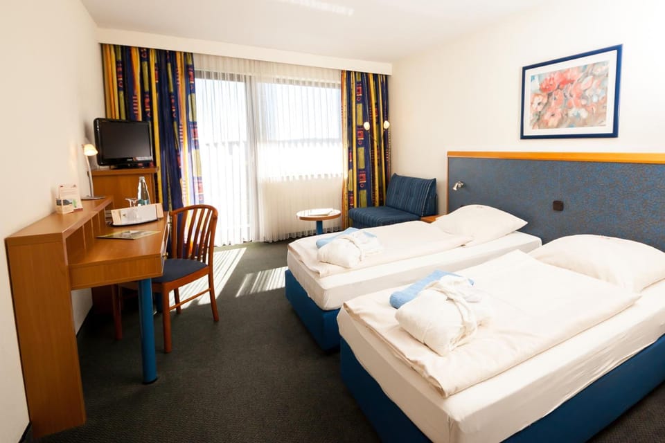 Desk, blackout drapes, soundproofing, rollaway beds
