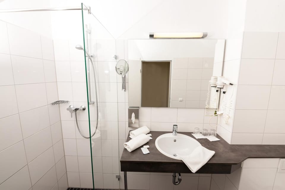 Shower, free toiletries, hair dryer, towels