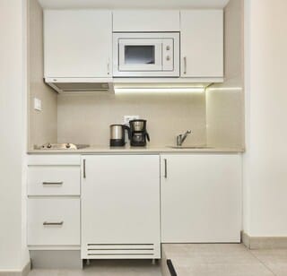 Studio, Balcony | Private kitchen | Mini-fridge, microwave, coffee/tea maker, electric kettle