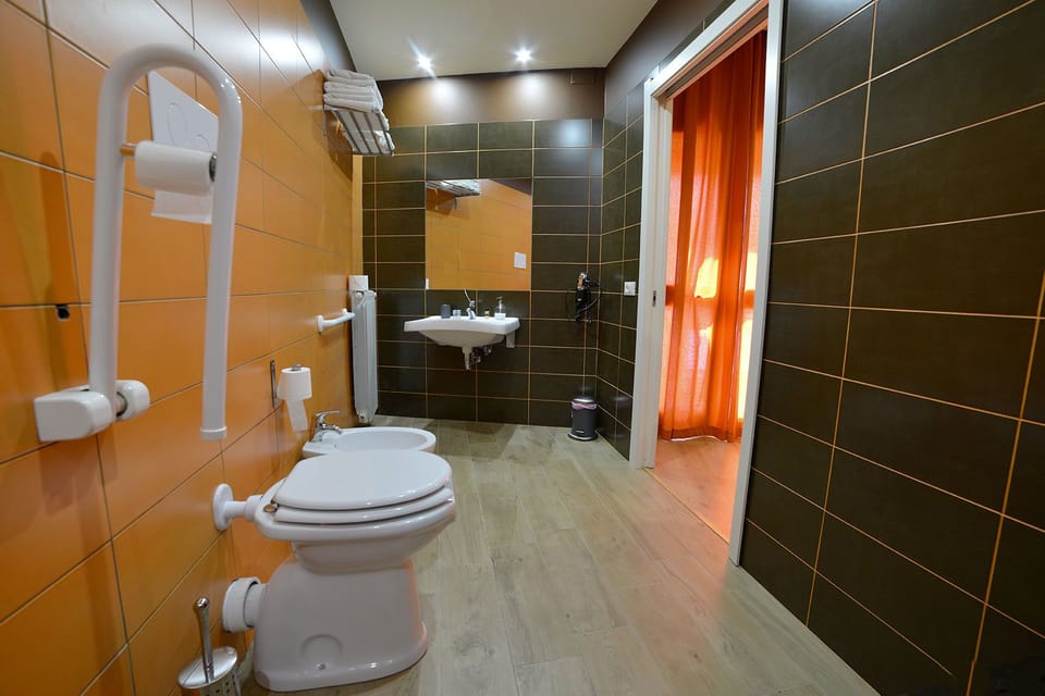 Triple Room, Accessible | Bathroom | Shower, rainfall showerhead, free toiletries, hair dryer