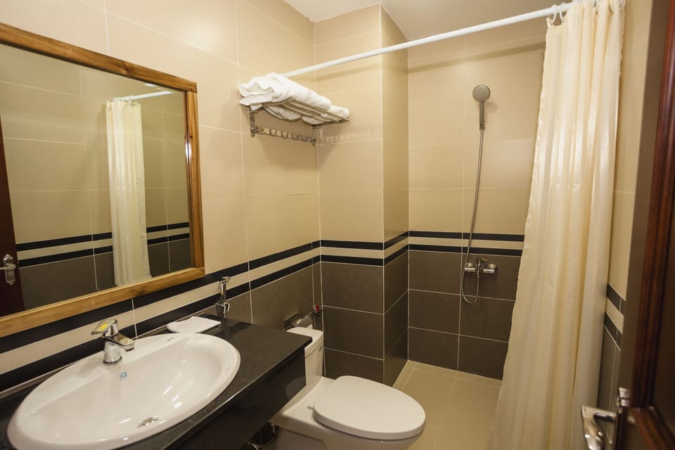 Shower, free toiletries, hair dryer, slippers