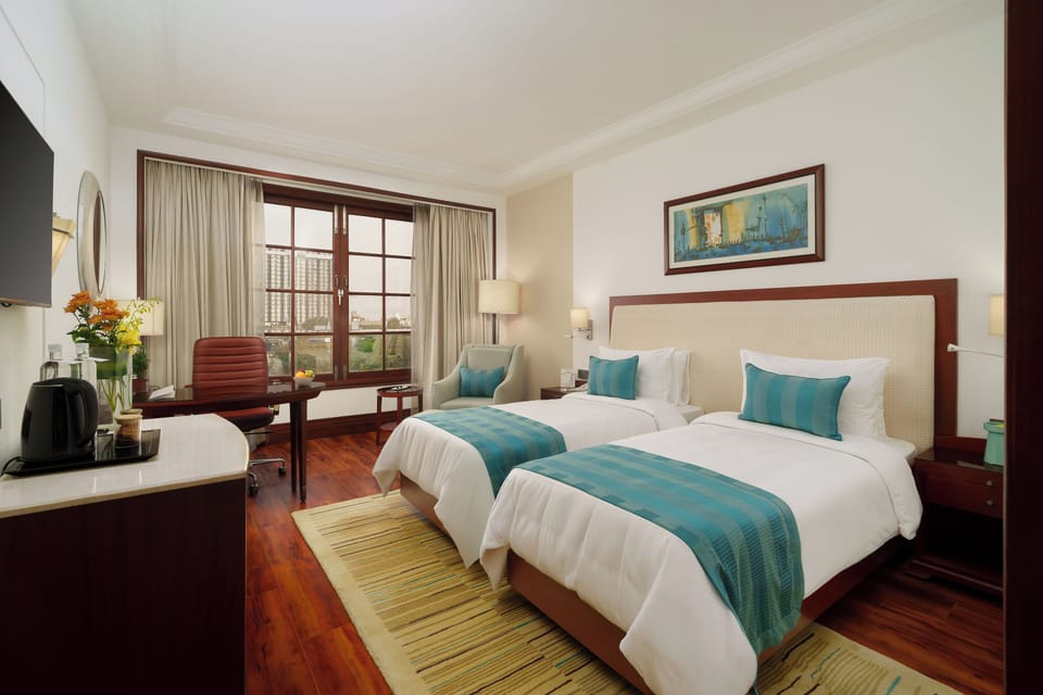 Superior Twin Room | Minibar, in-room safe, desk, laptop workspace