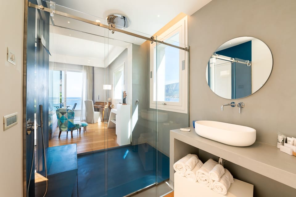 Junior Studio Suite, 1 King Bed, Hot Tub, Sea View | Bathroom | Designer toiletries, hair dryer, bathrobes, slippers