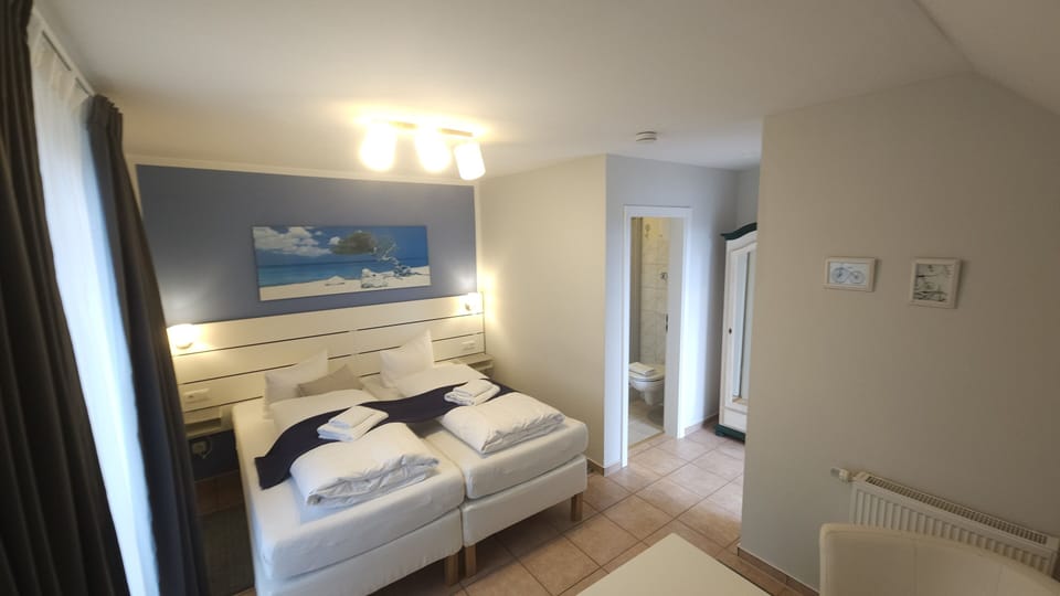Double Room | Down comforters, blackout drapes, iron/ironing board, free WiFi