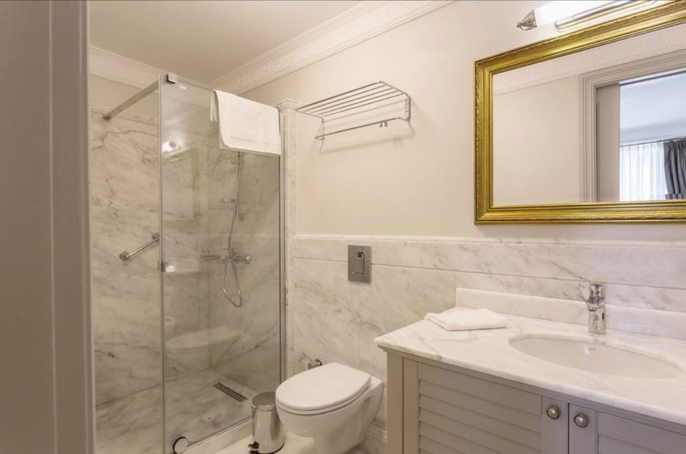 Shower, free toiletries, hair dryer, slippers