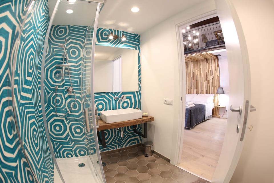 Deluxe Room, Multiple Beds, Non Smoking | Bathroom | Shower, free toiletries, hair dryer, bathrobes