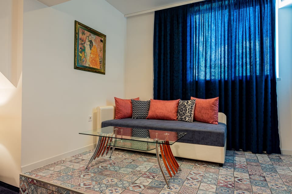 Deluxe Double Room | Living area | LED TV