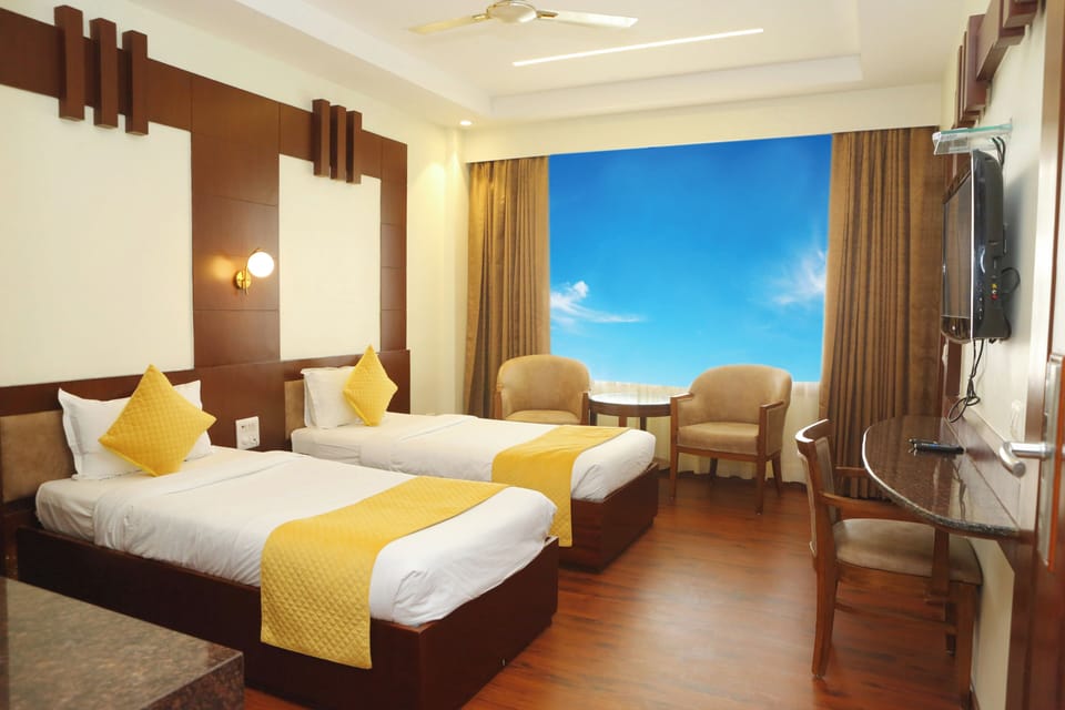 Deluxe Room, 1 Double or 2 Twin Beds, City View | Desk, laptop workspace, blackout drapes, soundproofing