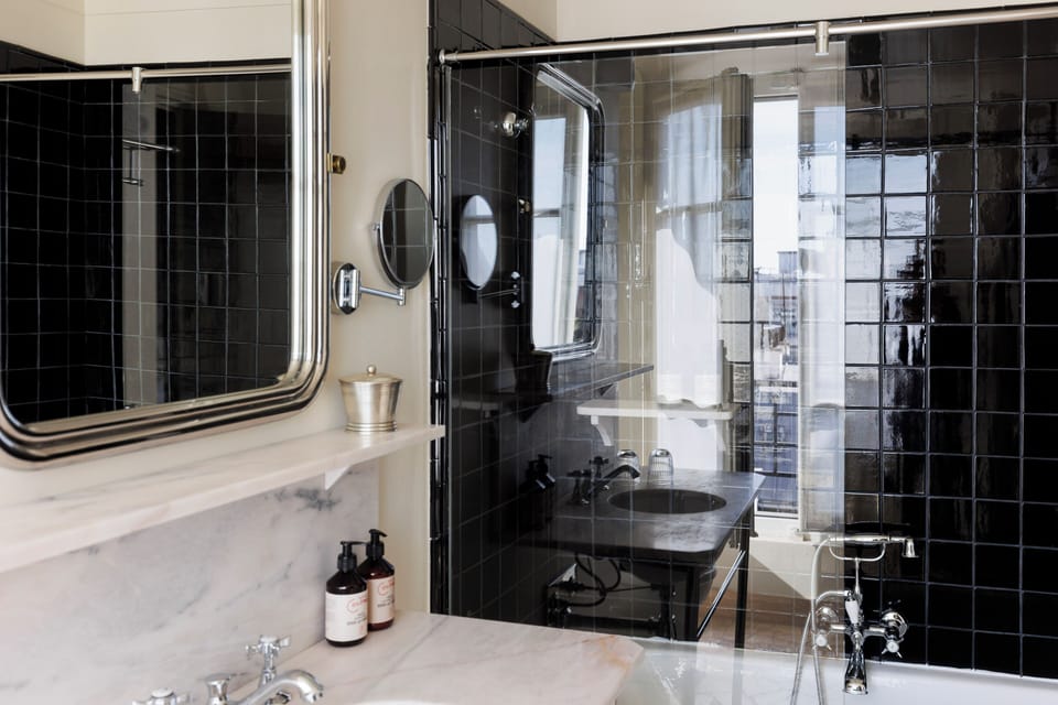 Eco-friendly toiletries, hair dryer, slippers, towels