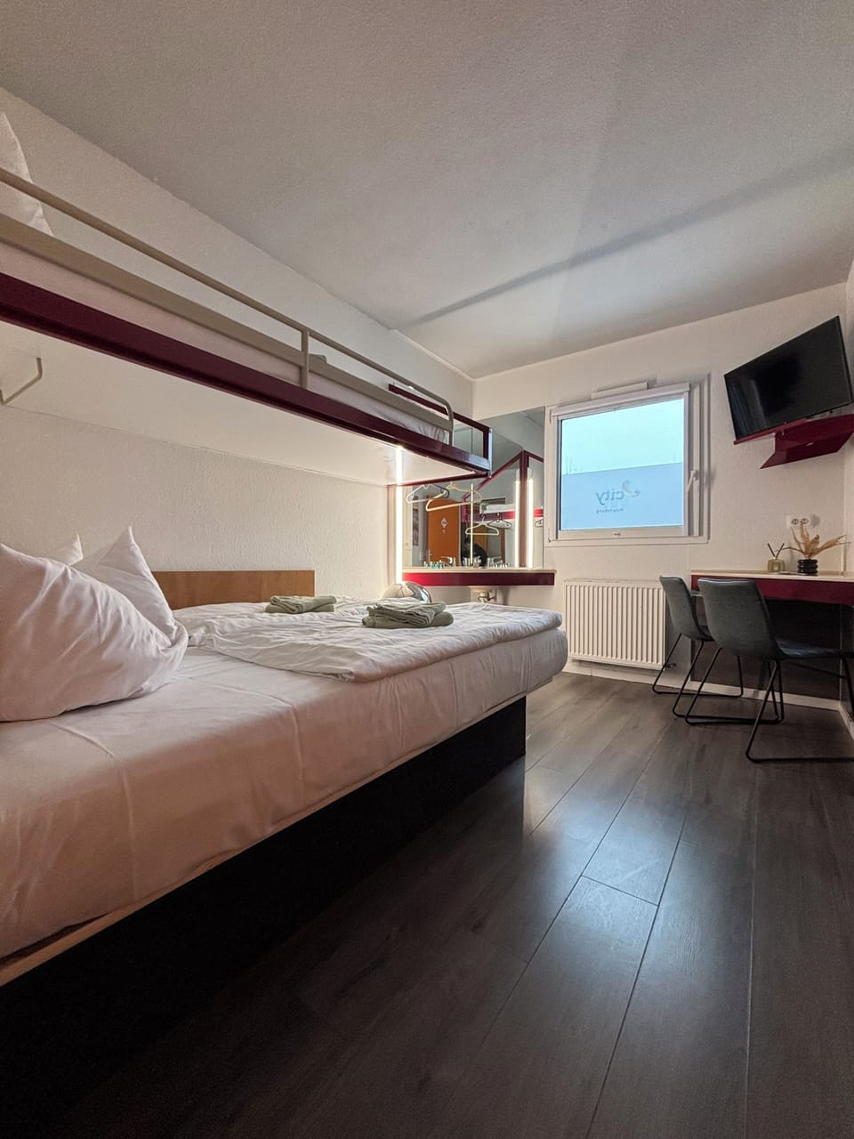 Economy Triple Room | Desk, blackout drapes, free WiFi, bed sheets