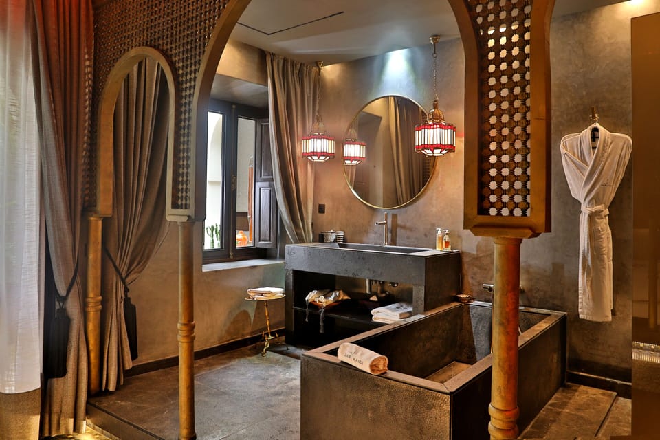 ARCH SUITE | Bathroom | Shower, deep soaking tub, designer toiletries, hair dryer