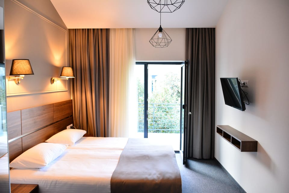 Superior Double or Twin Room | Minibar, in-room safe, blackout drapes, soundproofing