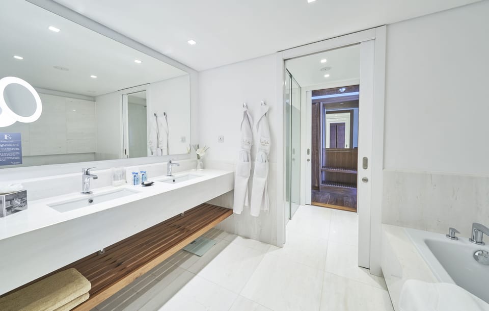 Separate tub and shower, hair dryer, bathrobes, slippers