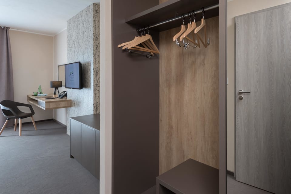 Triple Room, Garden Area | Minibar, in-room safe, desk, laptop workspace