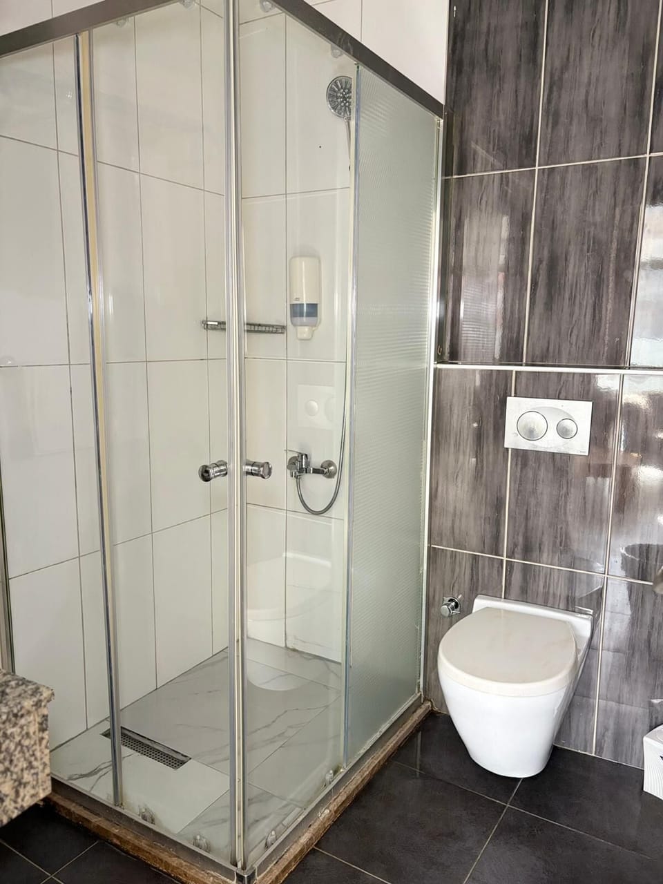 Shower, hair dryer, slippers, towels