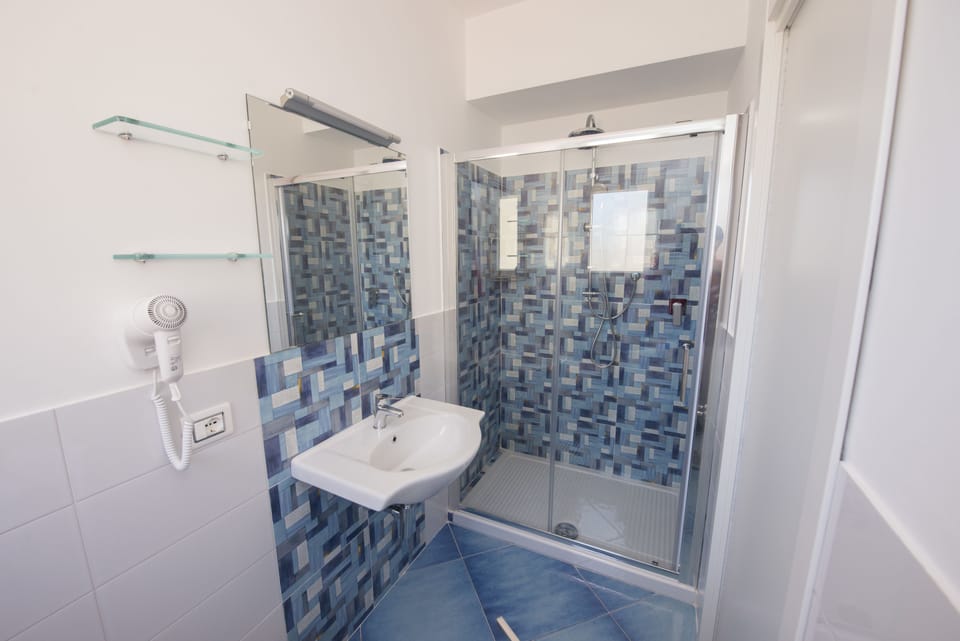 Comfort Triple Room, 1 Queen Bed with Sofa bed, City View (203) | Bathroom | Shower, rainfall showerhead, free toiletries, hair dryer