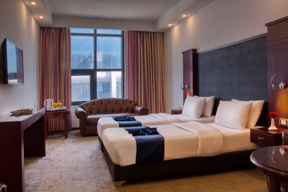 Hypo-allergenic bedding available, minibar, in-room safe