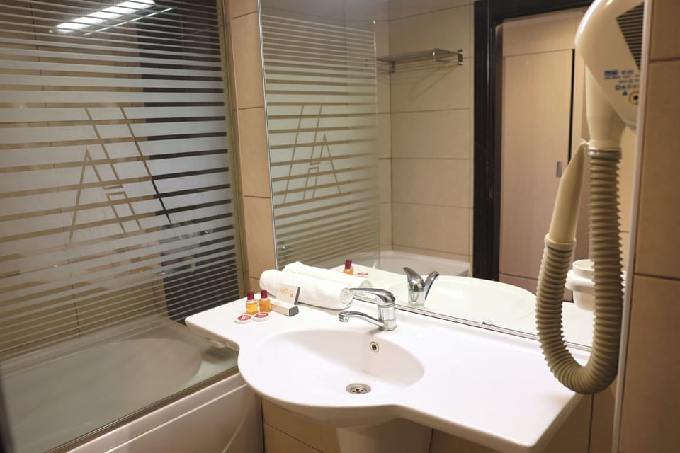 Standard Triple Room, Non Smoking | Bathroom | Bathtub, deep soaking tub, free toiletries, hair dryer