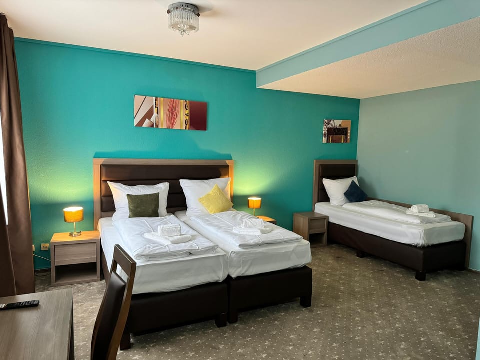 Standard Triple Room | Desk, soundproofing, iron/ironing board (on request), WiFi (free)