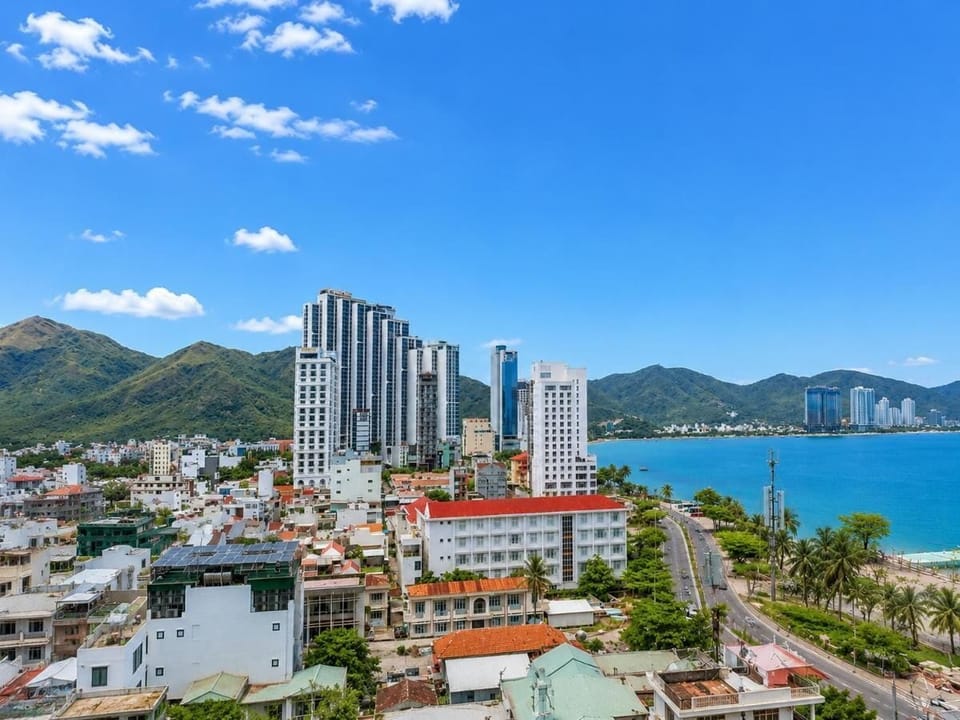 Deluxe Double Room, City View | Living area | 49-inch LCD TV with cable channels, TV