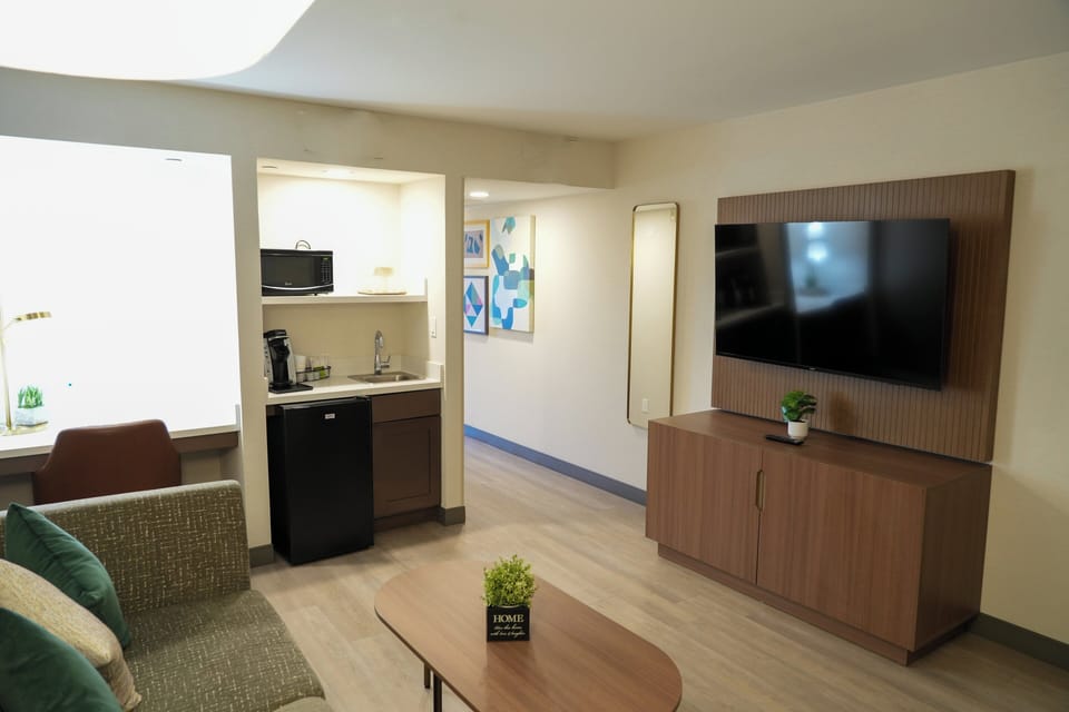Desk, laptop workspace, blackout drapes, iron/ironing board