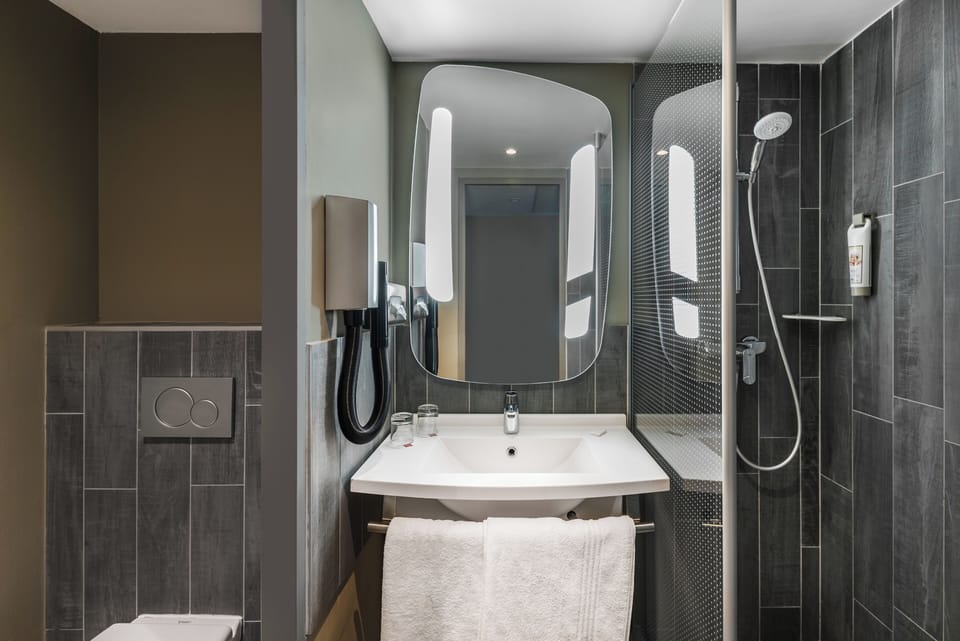 Shower, eco-friendly toiletries, hair dryer, towels