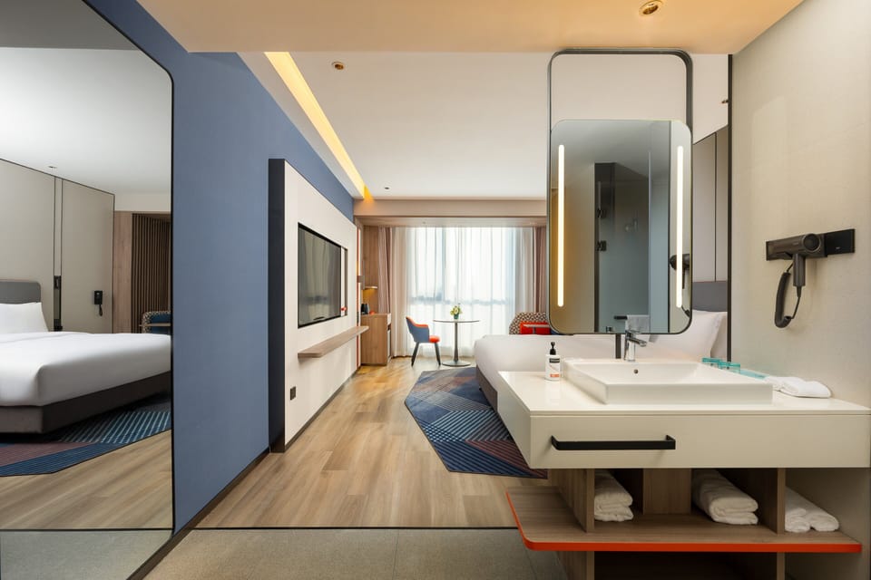 1 King Standard Extra Floor Space | Premium bedding, down comforters, laptop workspace, blackout drapes