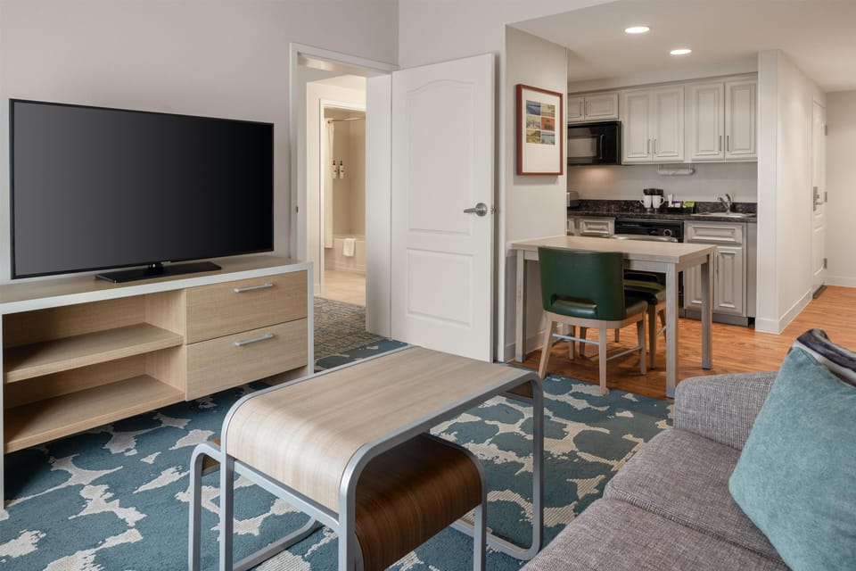 Suite, 2 Bedrooms, Non Smoking | Living area | 55-inch LED TV with cable channels, TV