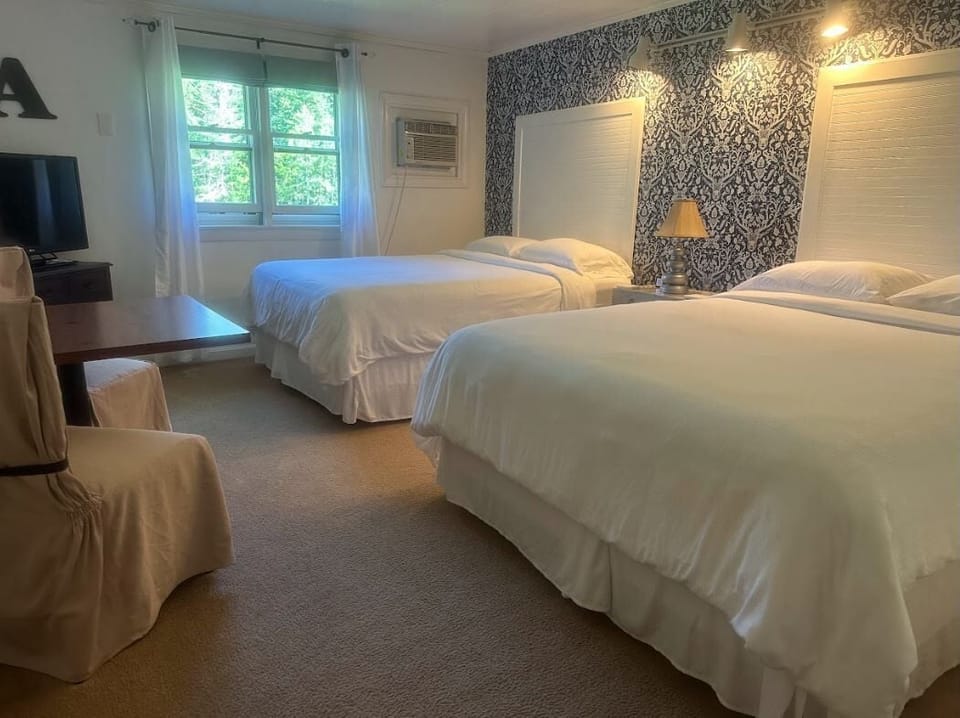 Standard Room, 2 Queen Beds | Individually decorated, individually furnished, laptop workspace