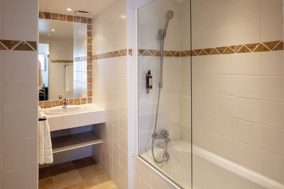 Shower, eco-friendly toiletries, hair dryer, towels