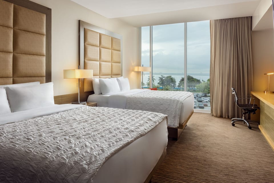 Premium bedding, down comforters, pillowtop beds, minibar