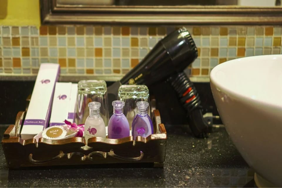 Deluxe Room, Pool View | Bathroom | Combined shower/tub, deep soaking tub, free toiletries, hair dryer