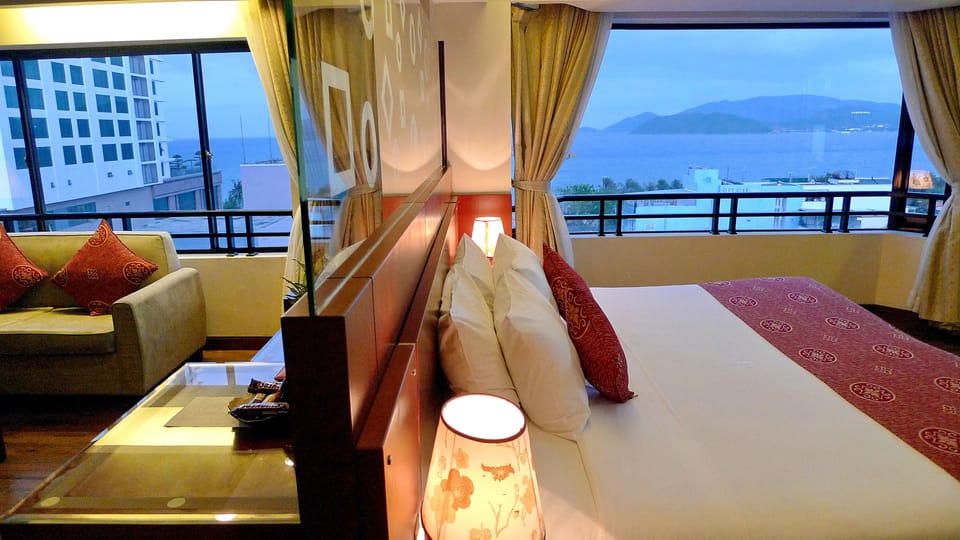 Suite, Sea View | Minibar, in-room safe, desk, blackout drapes