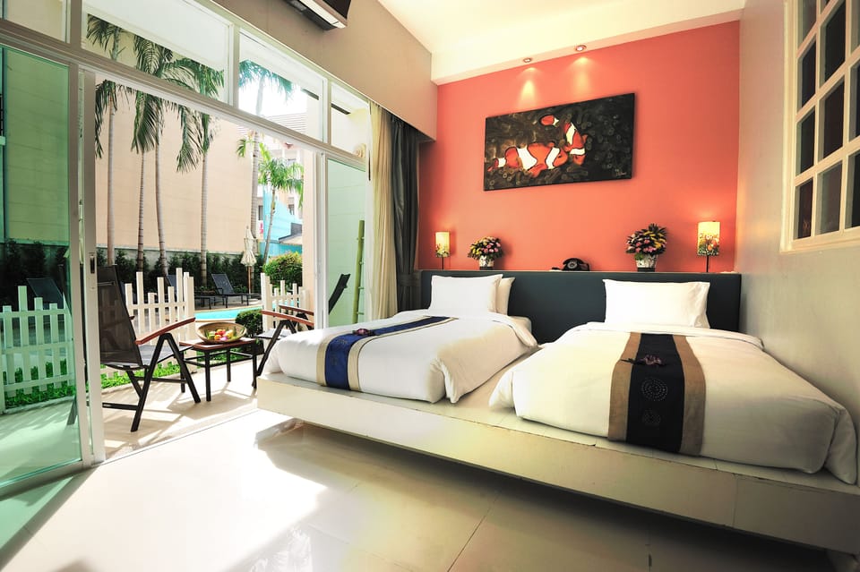 Deluxe Pool View | Premium bedding, in-room safe, desk, iron/ironing board