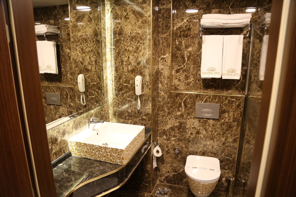 Shower, free toiletries, hair dryer, slippers