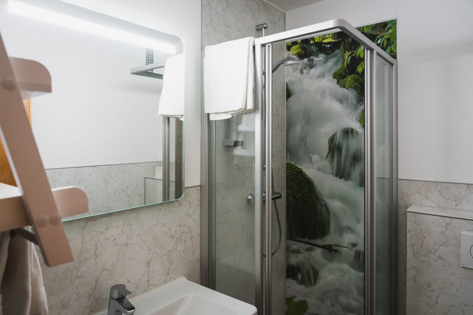 Shower, deep soaking tub, towels
