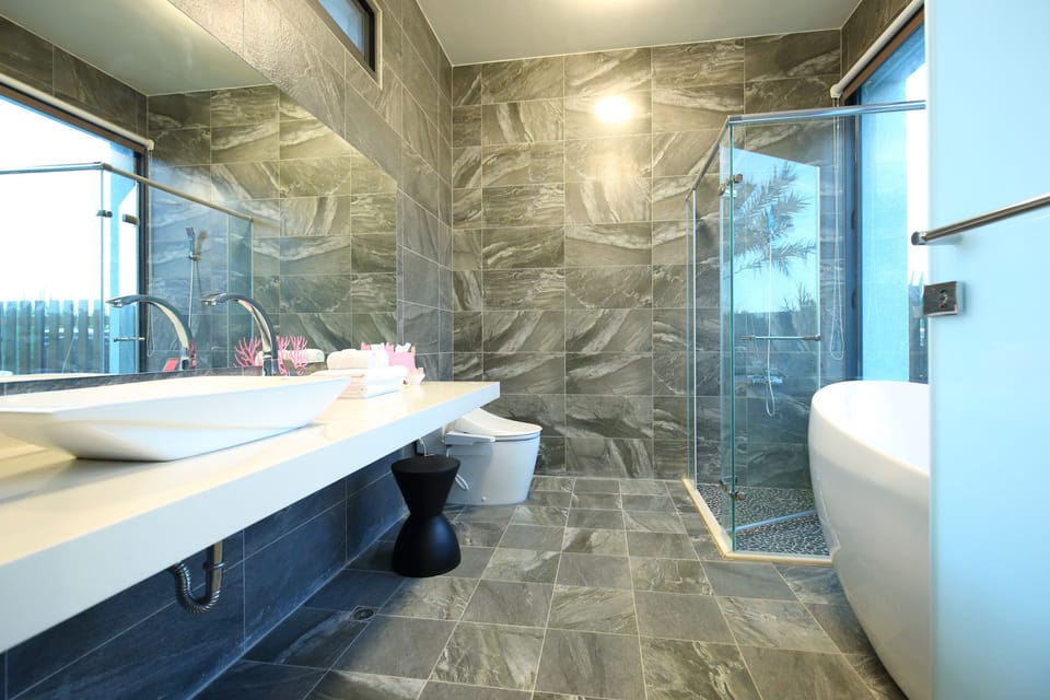 Signature House | Bathroom | Deep soaking tub, hydromassage showerhead, hair dryer, bathrobes