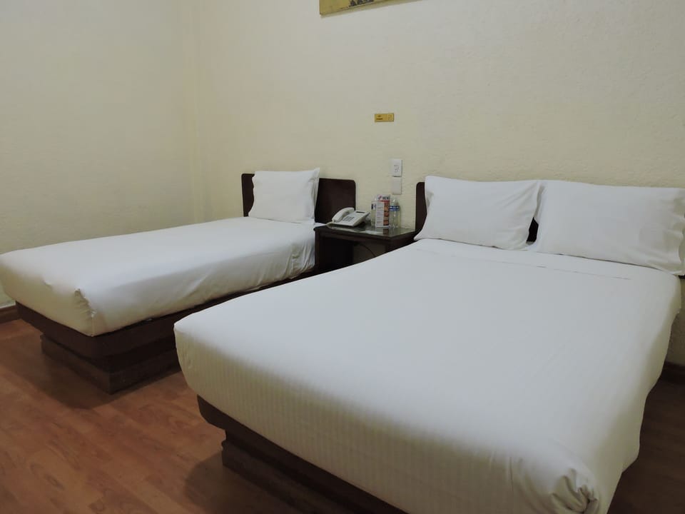 Triple Room, Multiple Beds, Non Smoking | Free WiFi, bed sheets