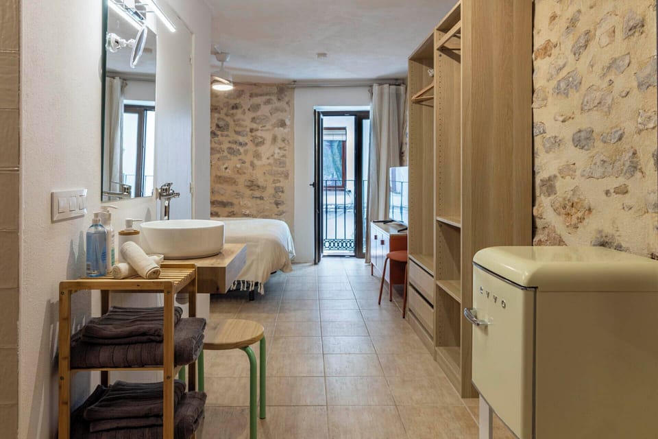 Junior Suite, 1 Bedroom | Desk, blackout drapes, iron/ironing board, free WiFi