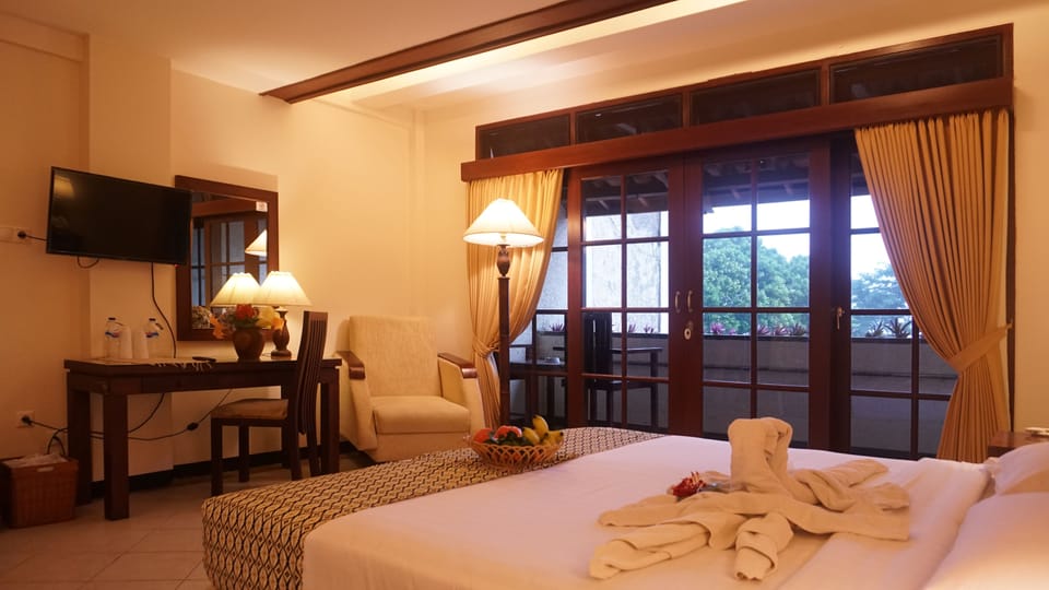 Superior Double or Twin Room | Living area | LCD TV