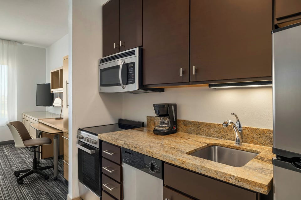 Studio, 2 Queen Beds | Private kitchen | Full-size fridge, microwave, stovetop, dishwasher