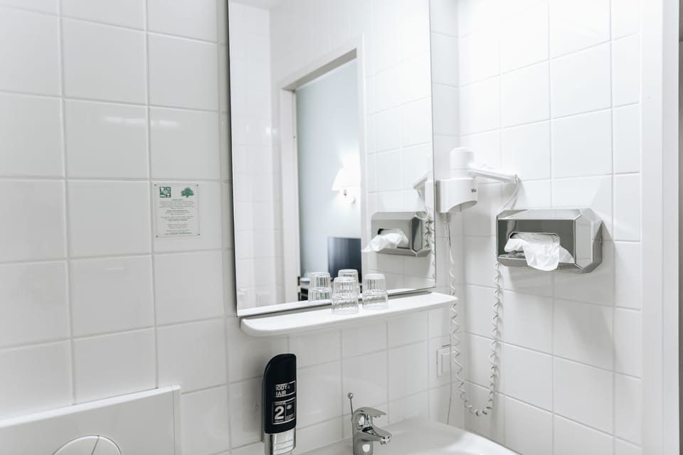Shower, rainfall showerhead, hair dryer, towels