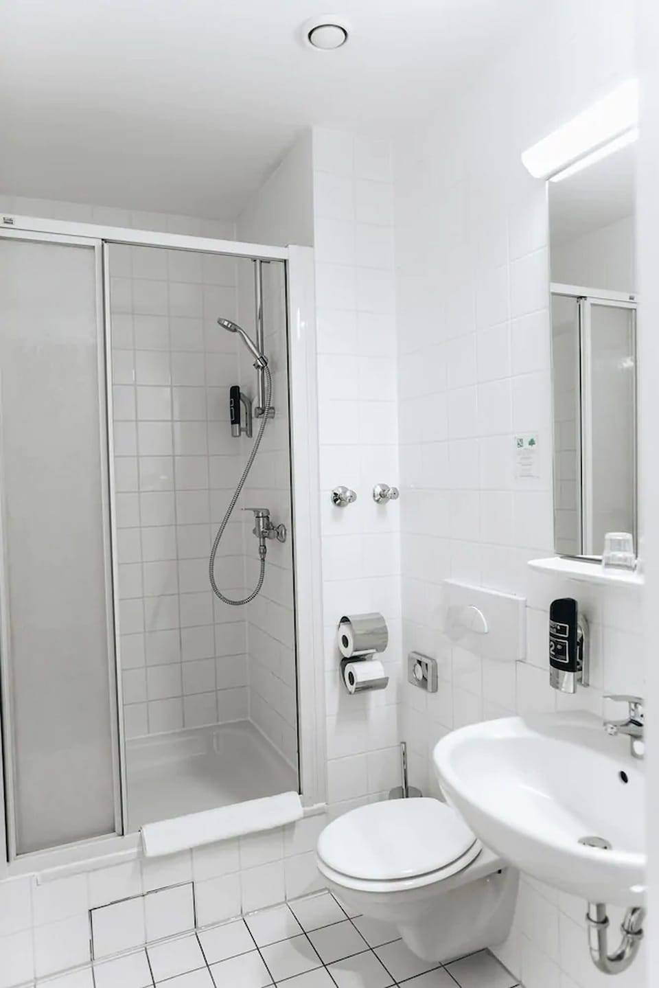 Shower, rainfall showerhead, hair dryer, towels