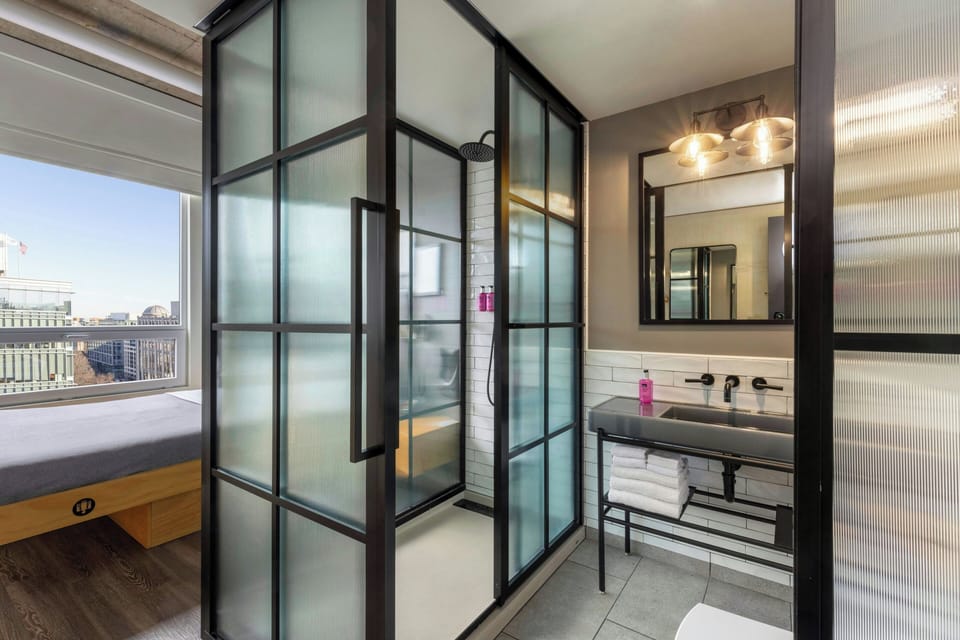 Shower, rainfall showerhead, designer toiletries, hair dryer