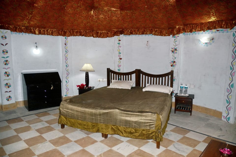 Desk, iron/ironing board, bed sheets