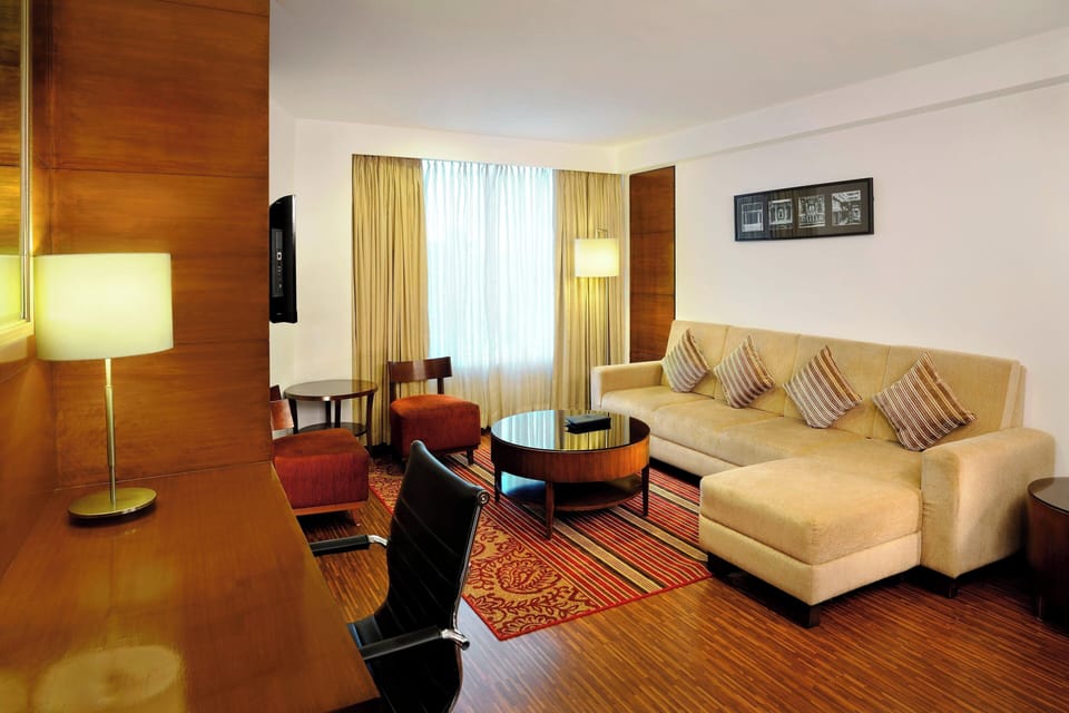 Suite, 1 King Bed, Smoking | Down comforters, minibar, in-room safe, desk