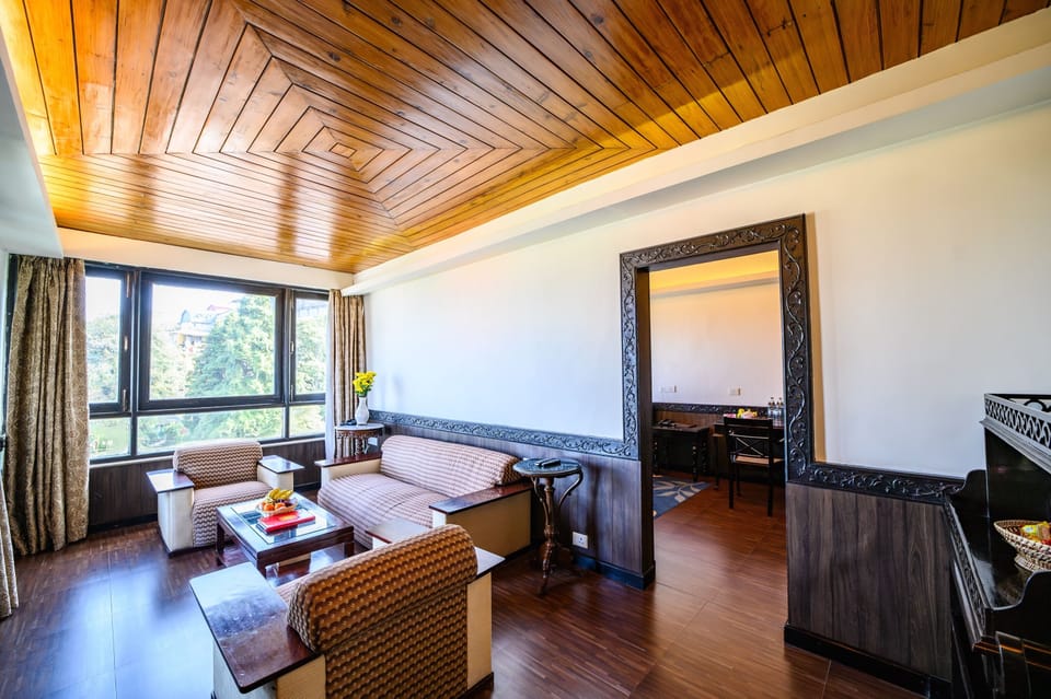 Burra Sahib Suite | Living area | 28-inch LCD TV with satellite channels, TV, books