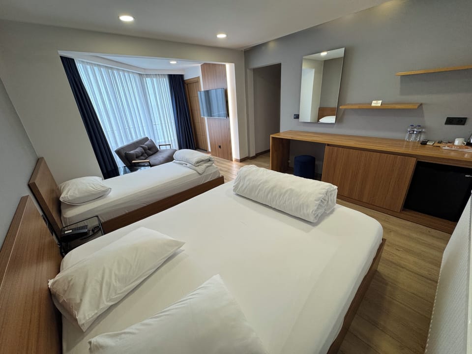 Family Room | Minibar, desk, laptop workspace, blackout drapes